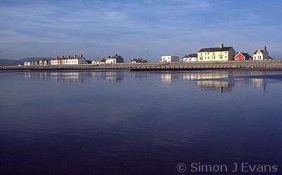 Reflections in the wet sand on Borth beach