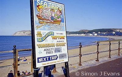 Boat trip noticebaord on Llandudno promenade 